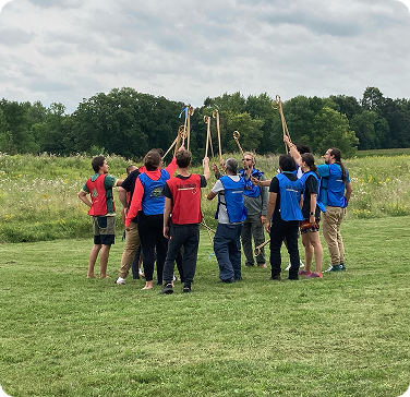 Community members gathered outdoors for a group event and activity.